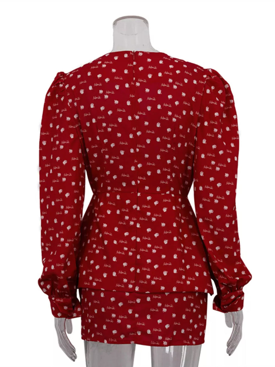 Red floral print blouse with puff sleeves and a cinched waist