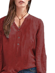 Burgundy long-sleeve blouse with V-neck and button detail