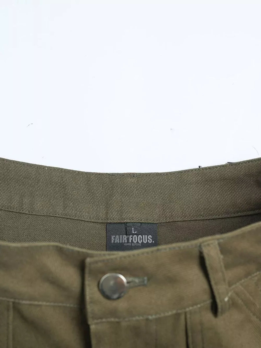 Olive green cotton cargo pants with button fly and visible brand tag.