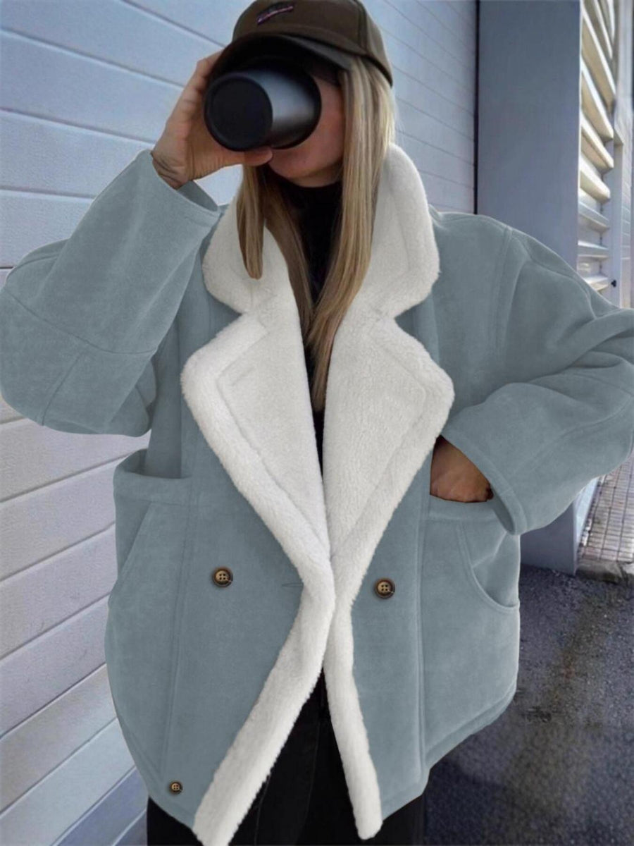 overcoat in slate blue featuring buttoned and loose fit