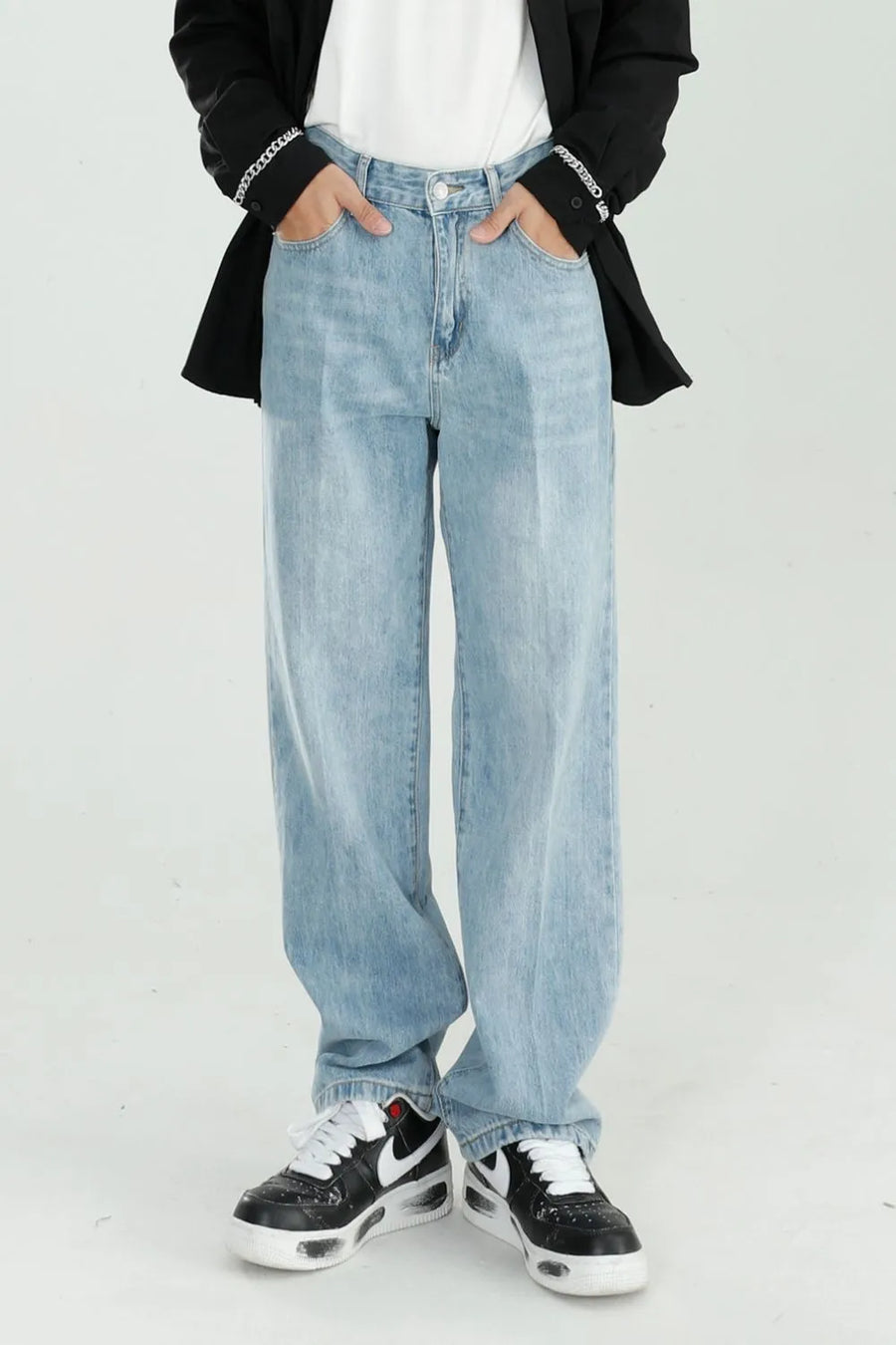 Relaxed fit light wash denim wide leg jeans with a casual, chic style.