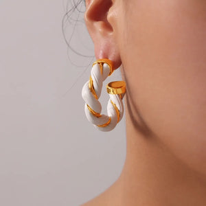 White braided leather hoop earrings with gold accents