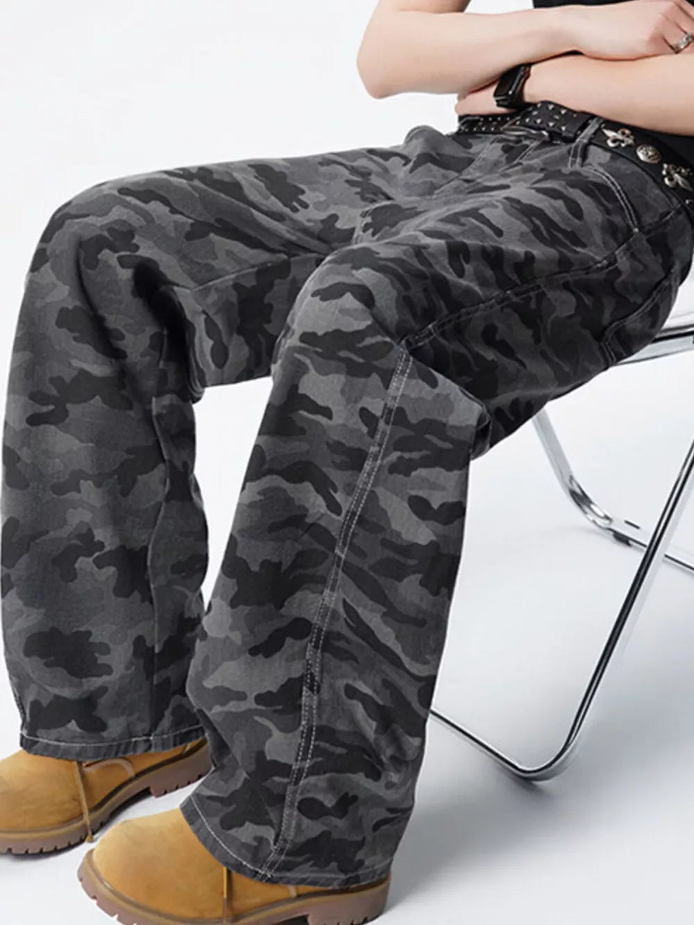 Men's relaxed fit dark grey camouflage cargo pants with visible stitching details.