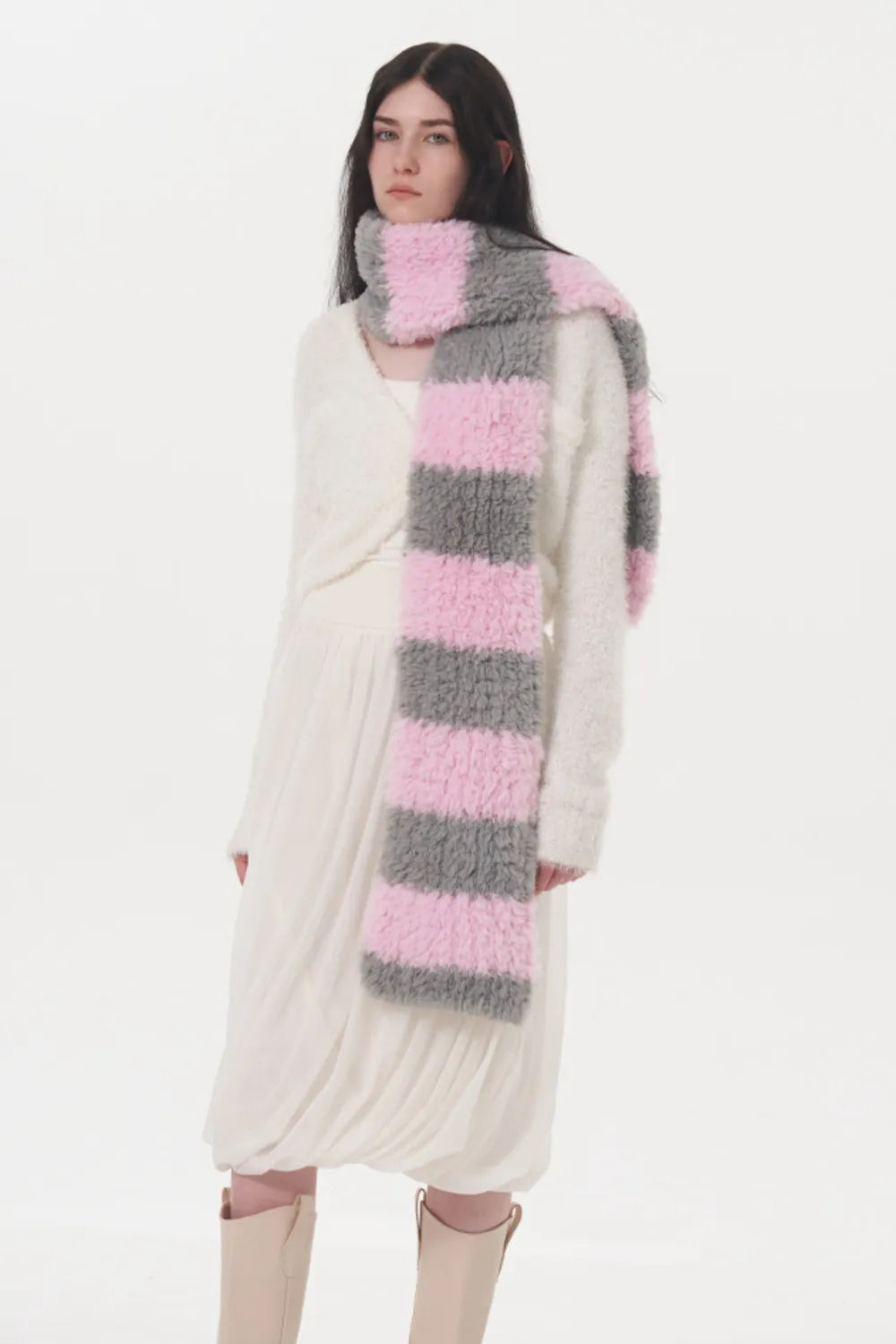 Plush hooded scarf with pink and gray stripes, attached hood, and cozy texture.