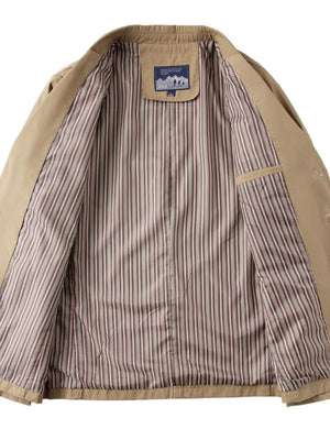 Khaki cotton lapel blazer interior with striped lining and pocket detail.