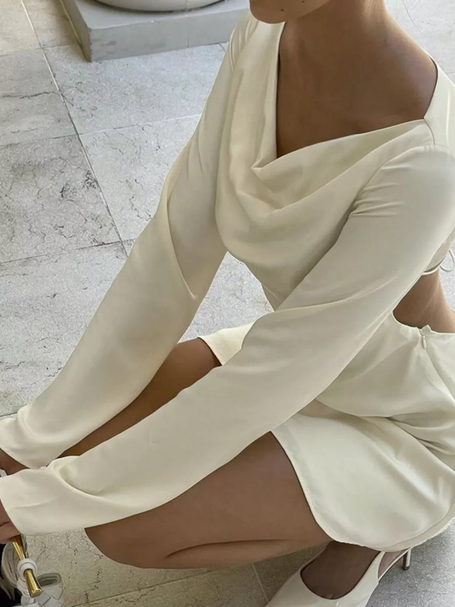 Cream cowl neck mini dress with long sleeves and open back detail