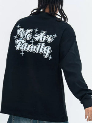 Black long sleeve tee with white "We Are Family" graphic and star accents on back.
