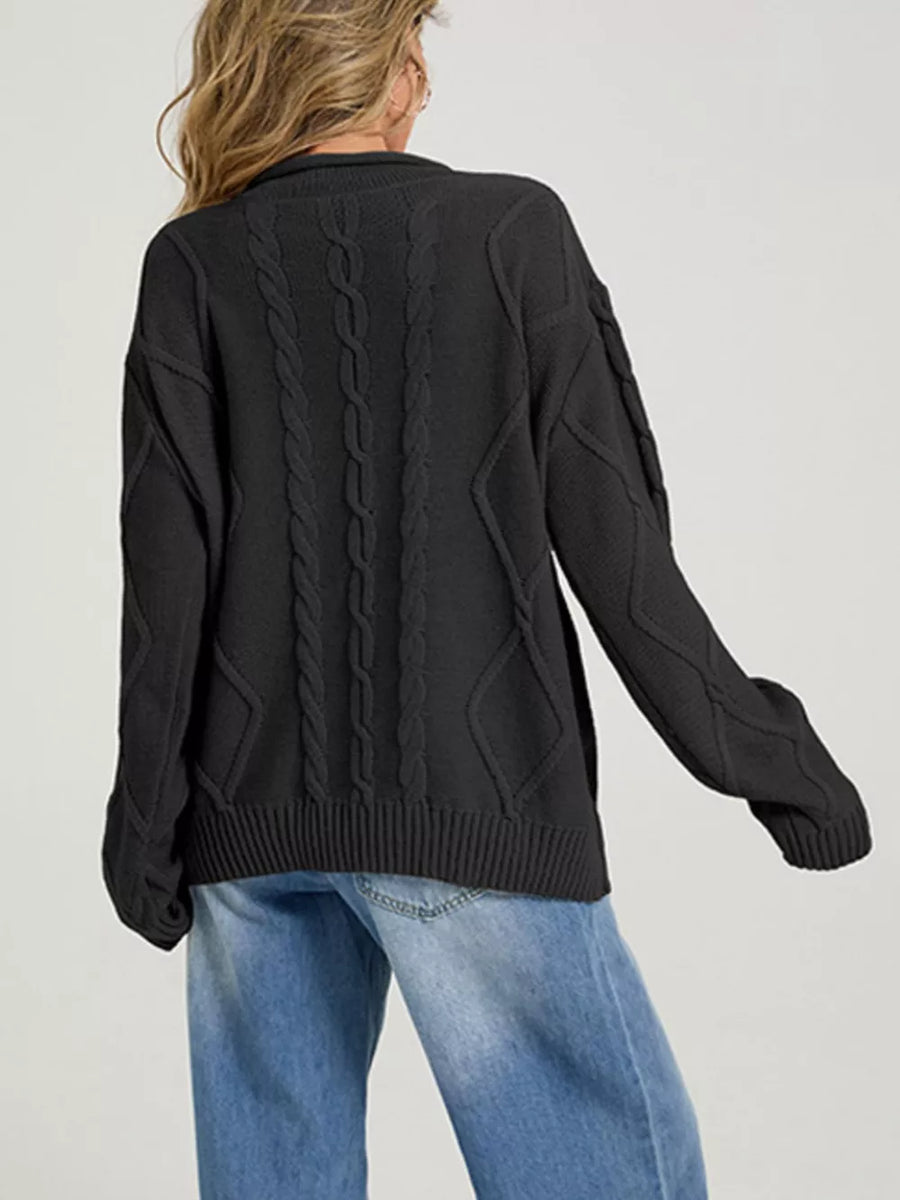pullover sweater featuring cable knit in Black with 100% Acrylic Care instructions: Machine wash cold texture