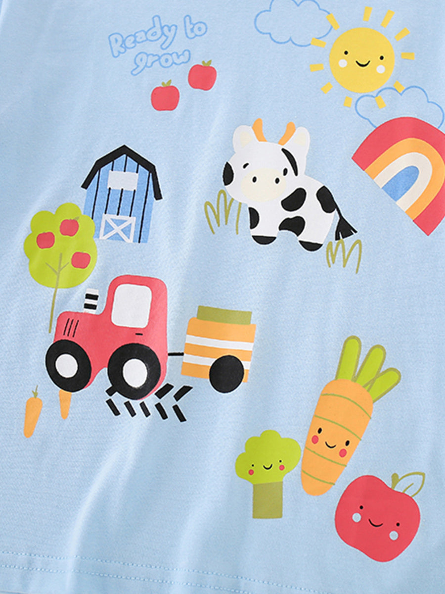Light blue cotton t-shirt with cartoon farm, tractor, cow, and smiling vegetables print.