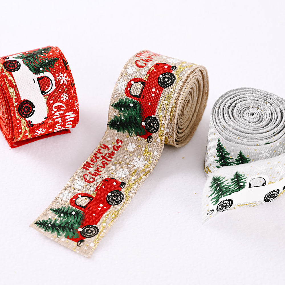 Festive ribbon with red trucks, Christmas trees, and snowflakes on beige, red, and light gray backgrounds.