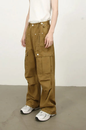 Khaki cargo pants with multiple pockets and a wide-leg cut.