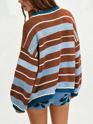 light blue pullover sweater featuring ribbed cuffs and striped
