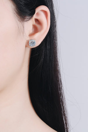 Silver cushion cut halo moissanite stud earrings with a square halo setting.