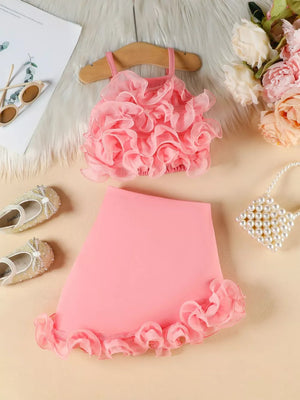 Pink baby cami and skirt set with delicate ruffles.