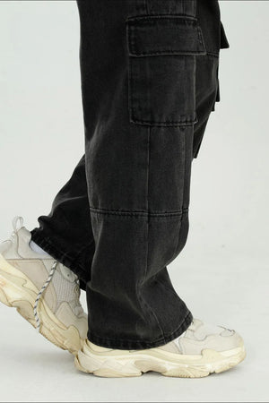 Black washed denim utility cargo pants with large side pockets.