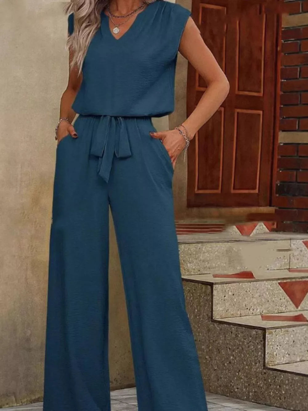 two-piece set in teal blue featuring side pockets and relaxed fit
