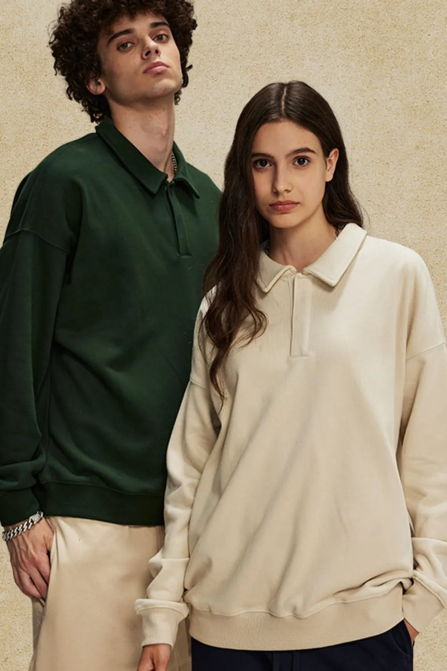Oversized polo sweatshirt in tan and dark green with collar and button placket.