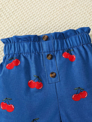 Blue cherry print shorts with ruffled waist and button detail