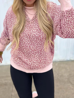 Relaxed fit dusty pink leopard print sweatshirt with a V-neck and long sleeves.