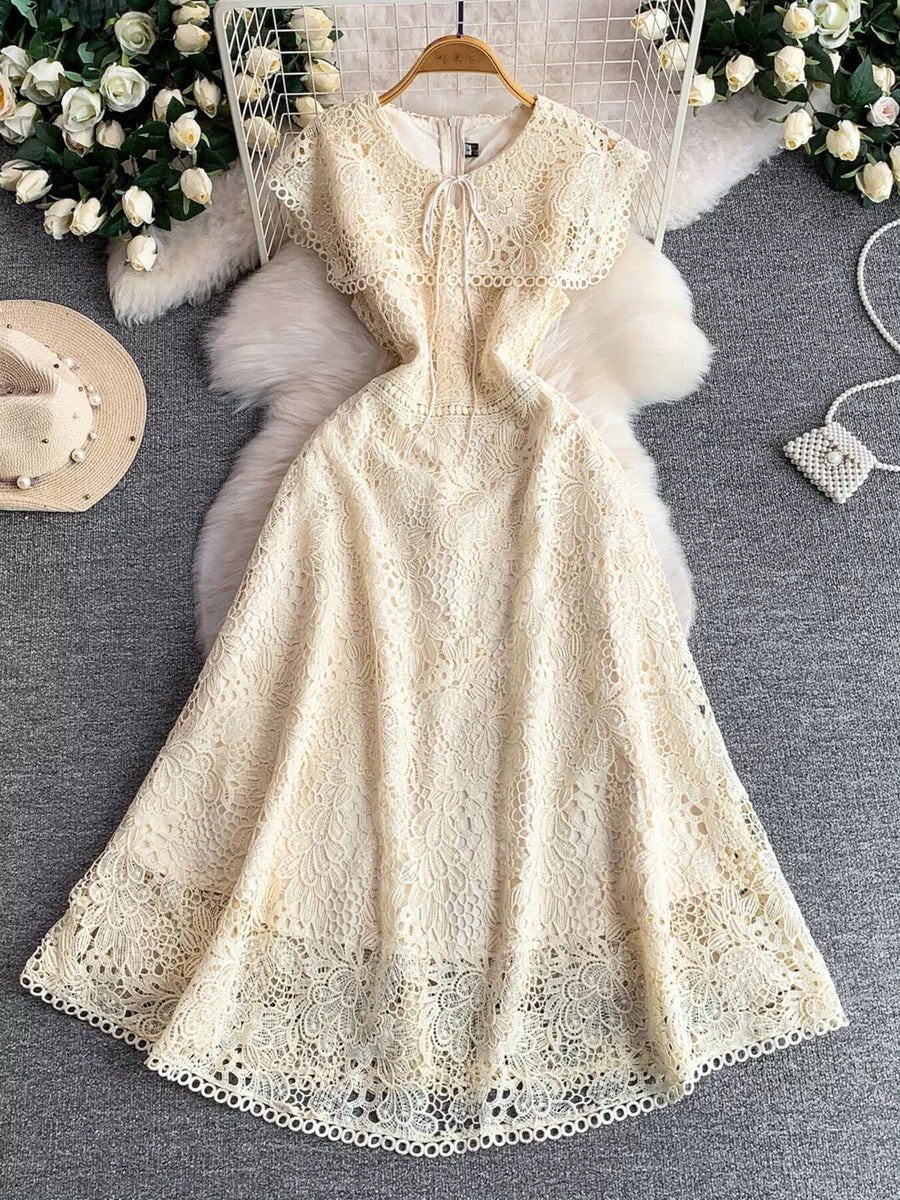Apricot lace A-line dress with tie detail and cutout neckline.