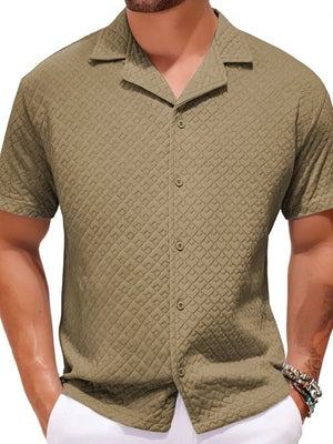 Textured quilted camp collar shirt in khaki with button front and short sleeves.
