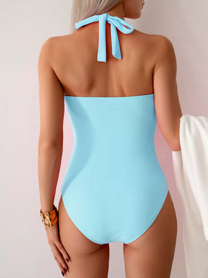 Ice Blue twisted front halter one-piece swimsuit with tie back.