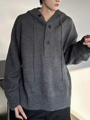 Gray hooded knit sweater with button detail and drawstring neckline.