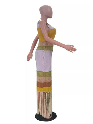 Vibrant color block knit maxi dress with fringe hem and split detail.