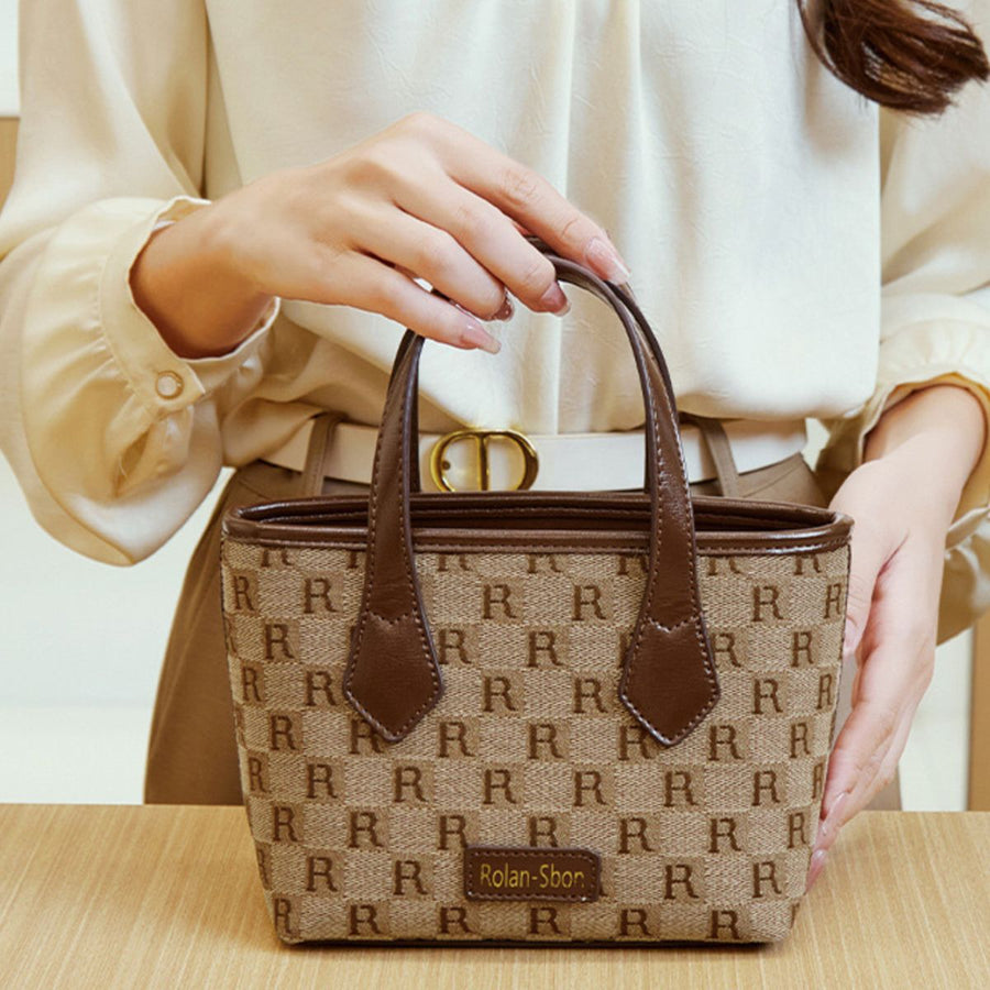 crossbody bag featuring monogram in tan with PU Leather Imported Size &amp texture