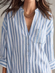 white shirt dress featuring buttoned and striped