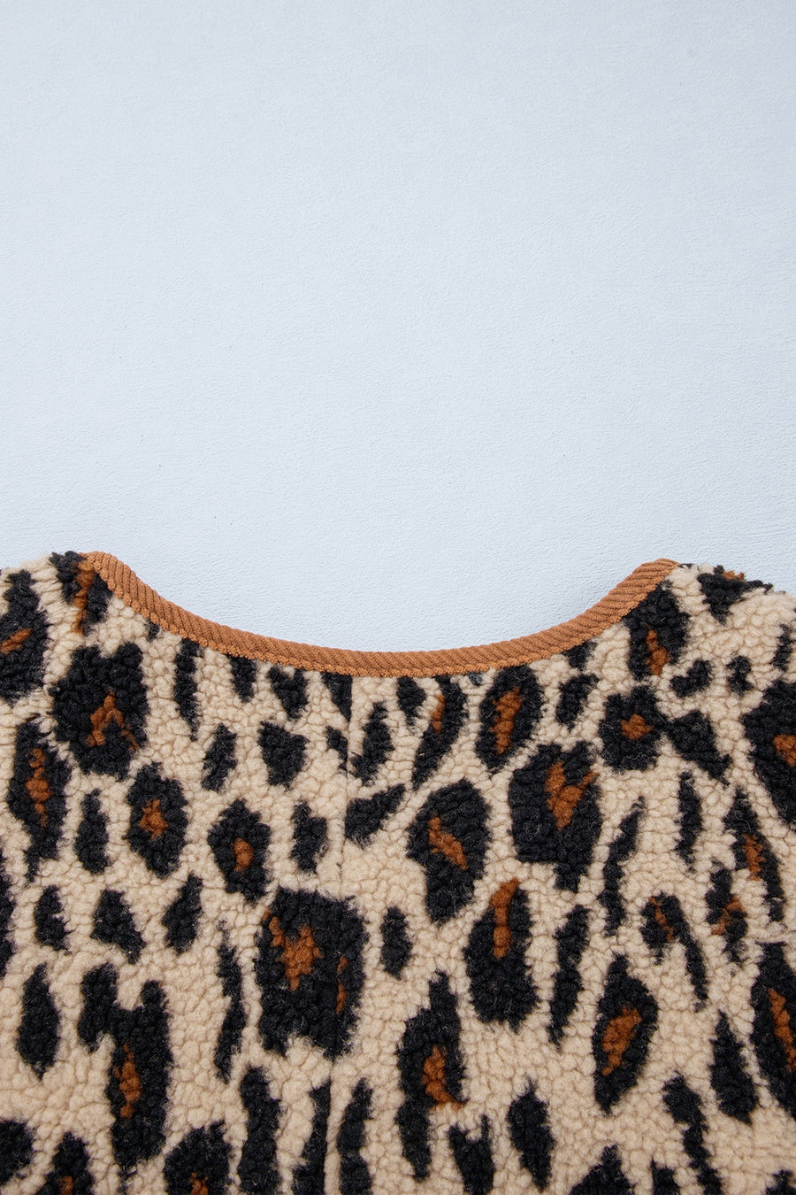 jacket in dark brown with buttoned and hip-length