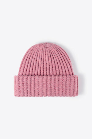 Pink ribbed knit beanie with textured detail