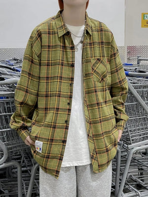 Plus-size green plaid long-sleeve button-up shirt with a chest pocket.