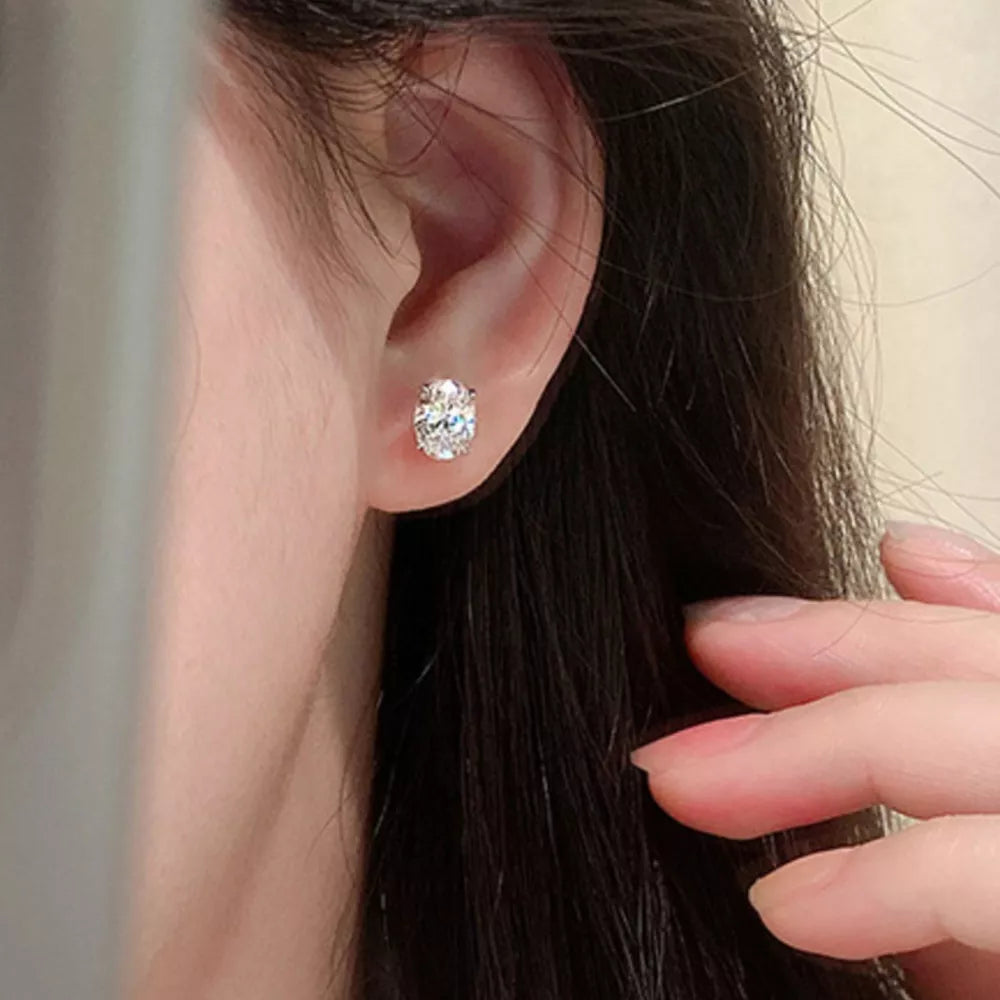 earrings in silver featuring faceted stone and stud fit