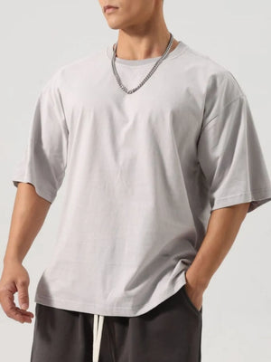 Boxy cut gray washed cotton t-shirt with crew neck and short sleeves.