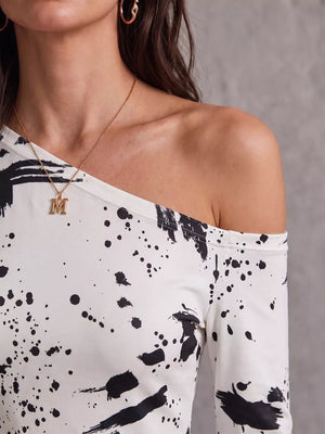 Beige bodycon dress with pullover and paint splatter