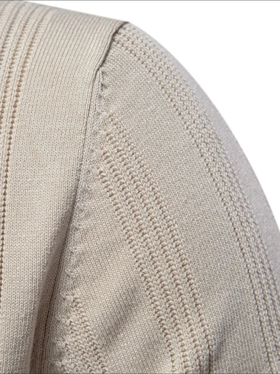 Beige ribbed knit polo shirt with vertical textured details on the shoulder and sleeve.