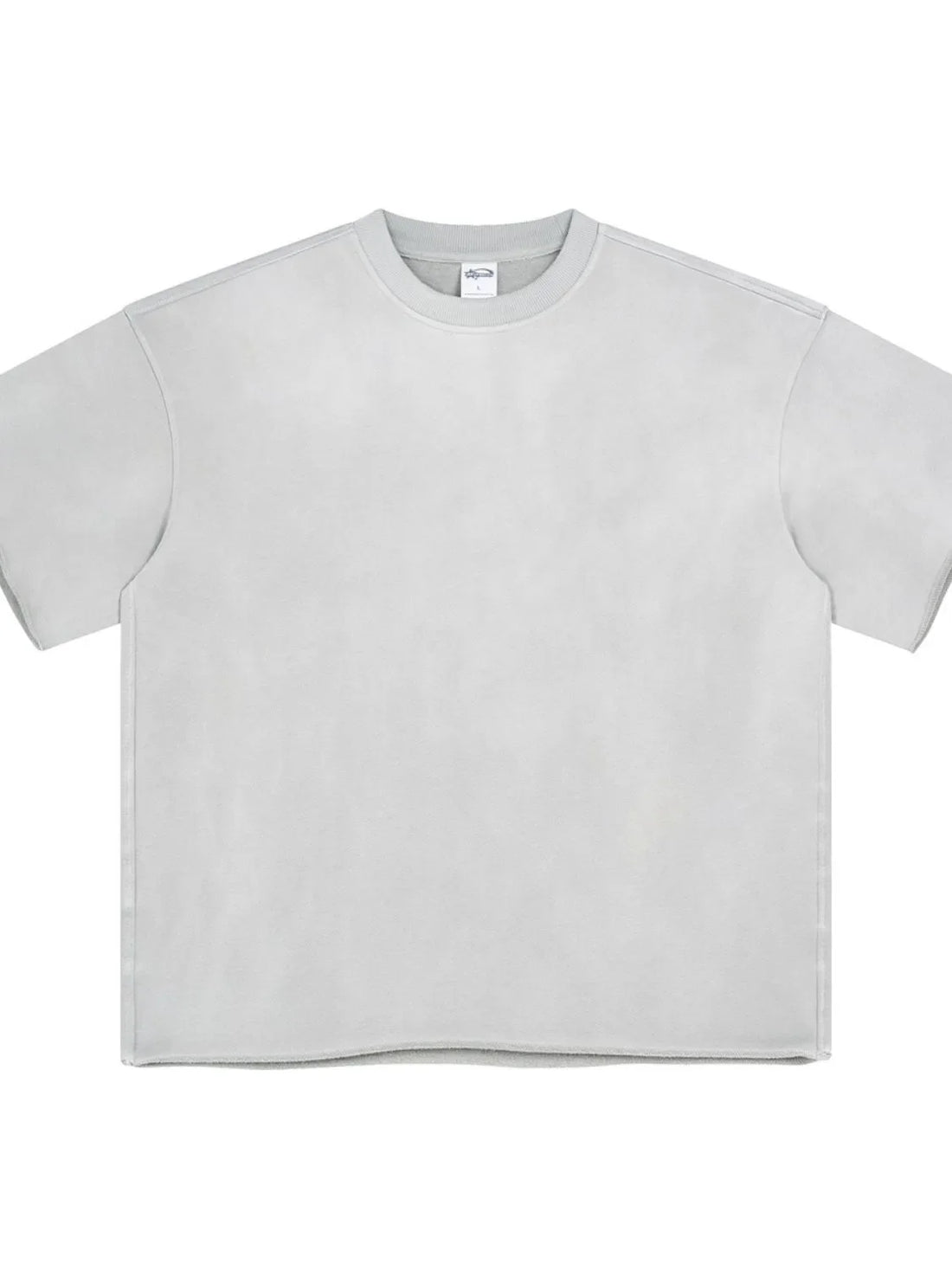 Raw edge boxy t-shirt in light gray with crew neck and short sleeves.