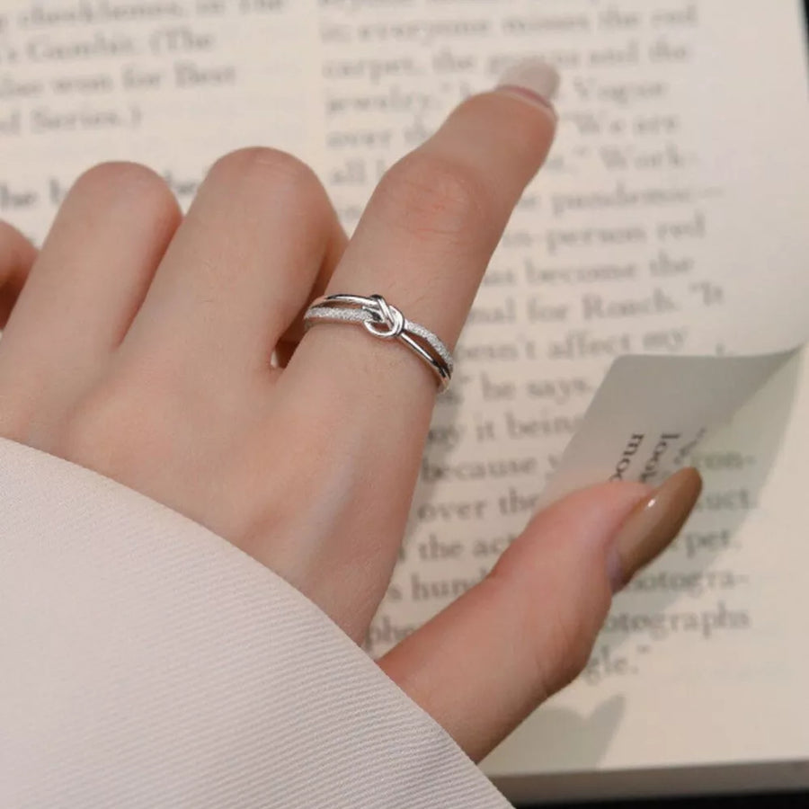 silver with ring with knot detail