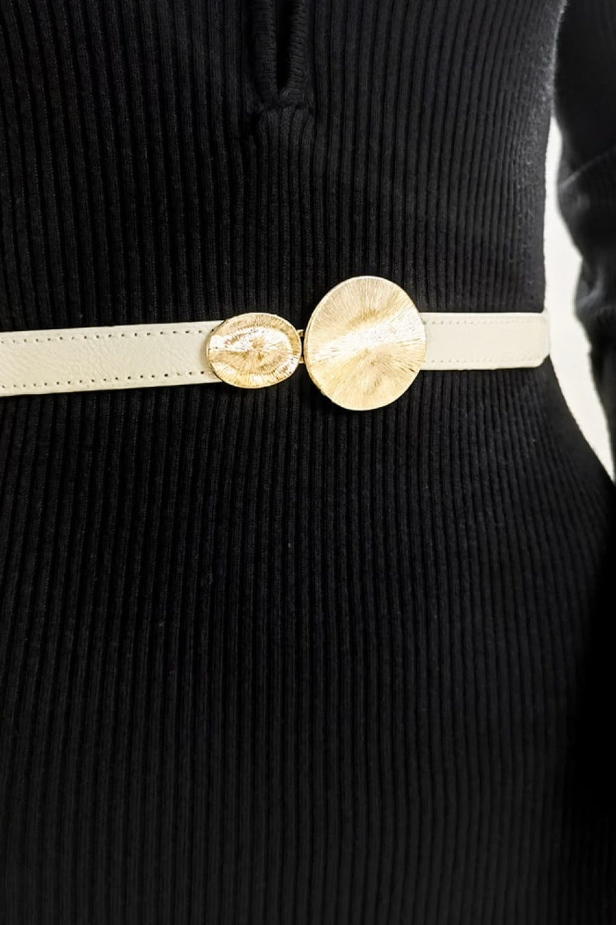 Ivory elastic waist belt with gold disc detail.
