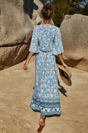 Light blue floral viscose crop top and maxi skirt set with wide sleeves and a border print hem.