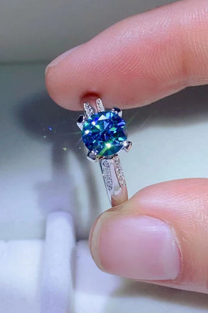 Celestial blue moissanite engagement ring with diamond band