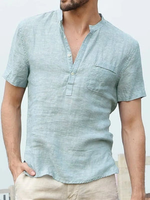 Light blue linen henley shirt with short sleeves and chest pocket.