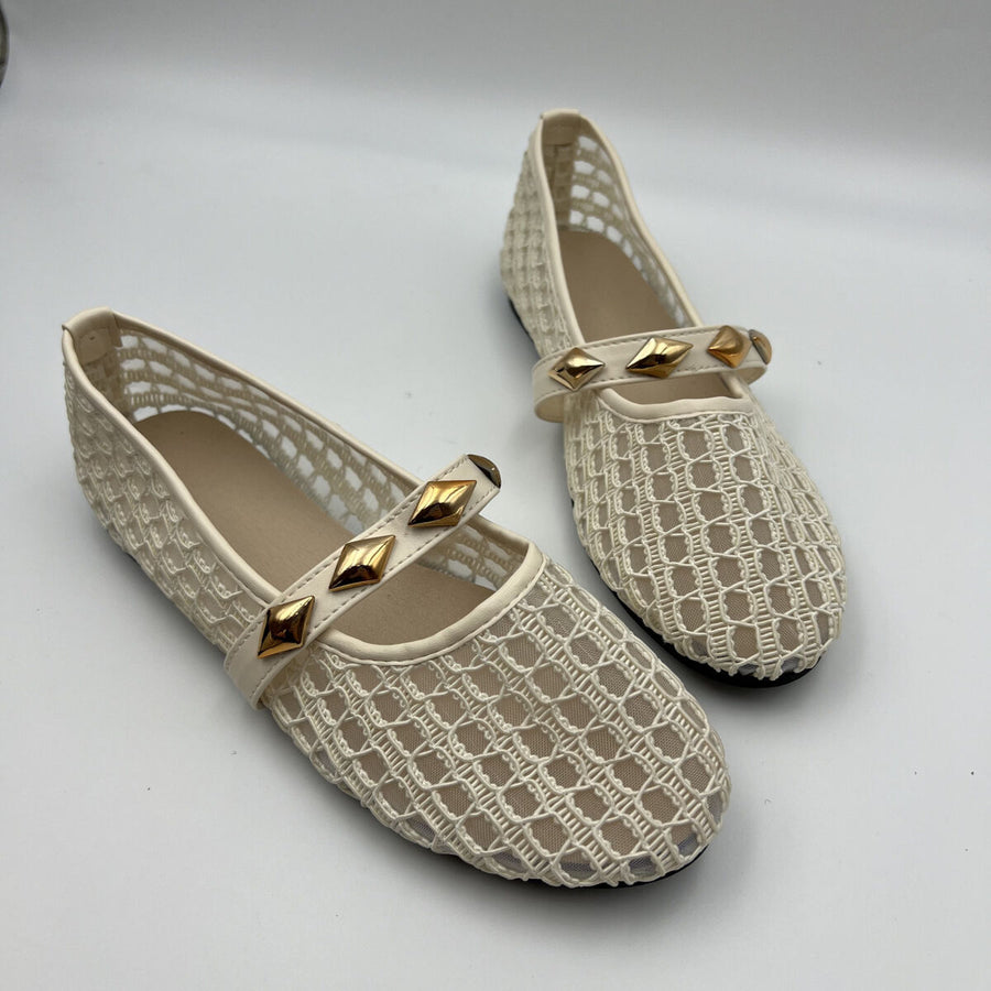 flats in Black with geometric and round toe