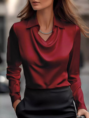 Burgundy satin cowl neck long-sleeve blouse with a collar.
