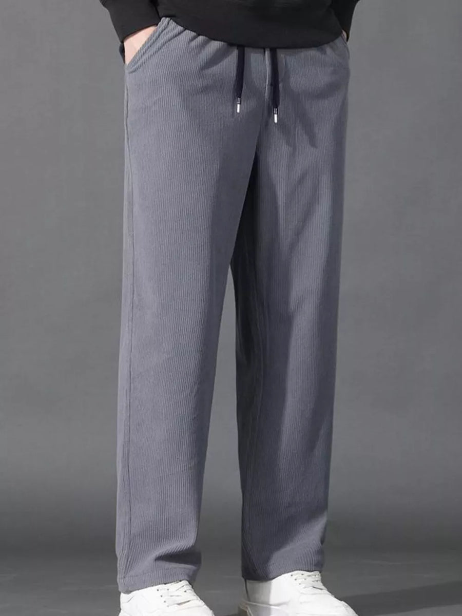 Light gray corduroy joggers with drawstring waist and pockets.