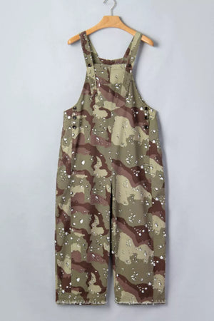 Cropped denim overalls in camouflage print with button details and distressed hem.