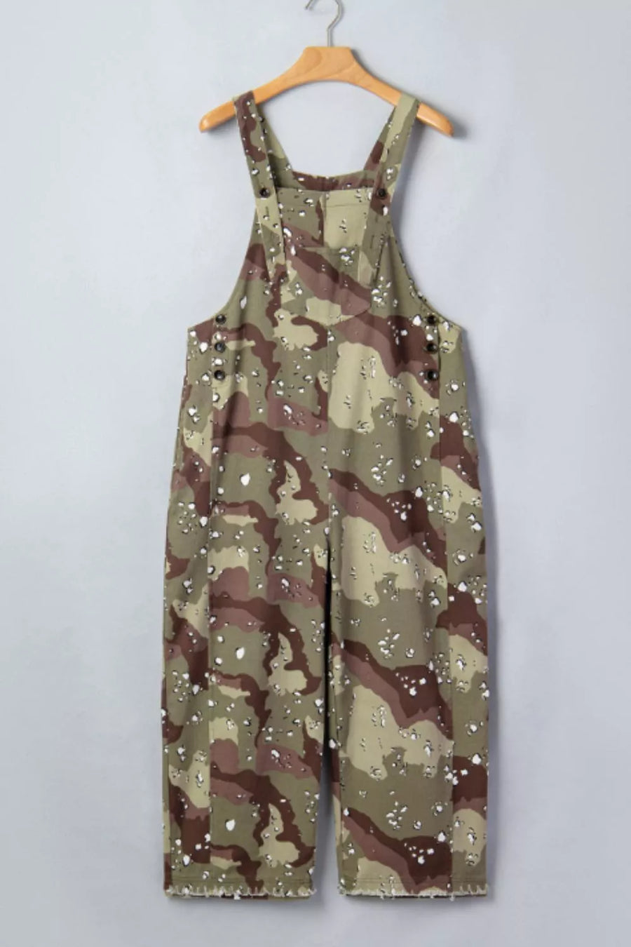 Cropped denim overalls in camouflage print with button details and distressed hem.
