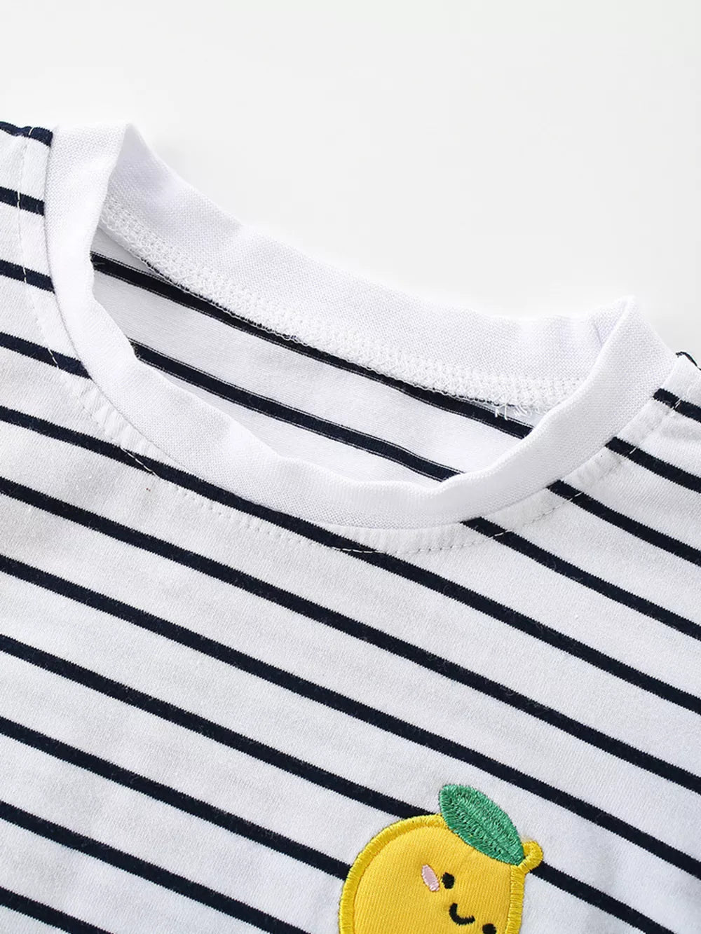 Baby t-shirt with navy stripes and a cheerful lemon applique.