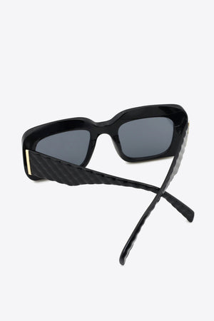 Black rectangular sunglasses with textured arms and gold detail
